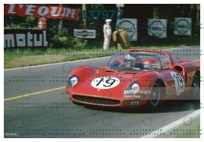 the-red-ferrari-330-p2-spyder-race-car-is-driven-by-a-member-of-the-picture-id57590840.jpg