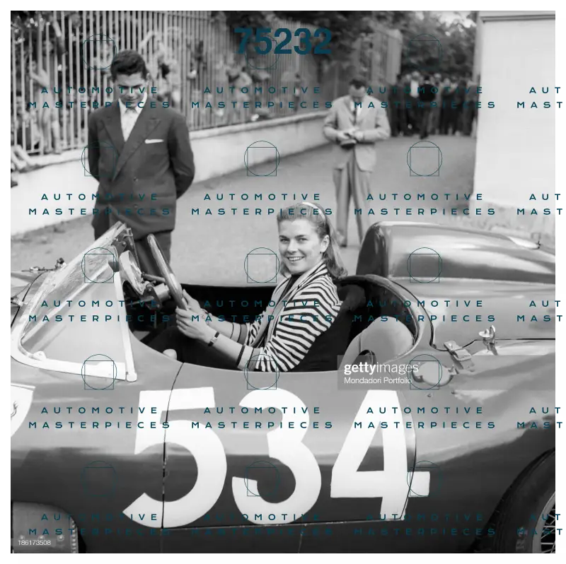 GETTY 186173508_louise-collins-posing-smiling-at-the-wheel-of-the-car-driven-by-her.jpg