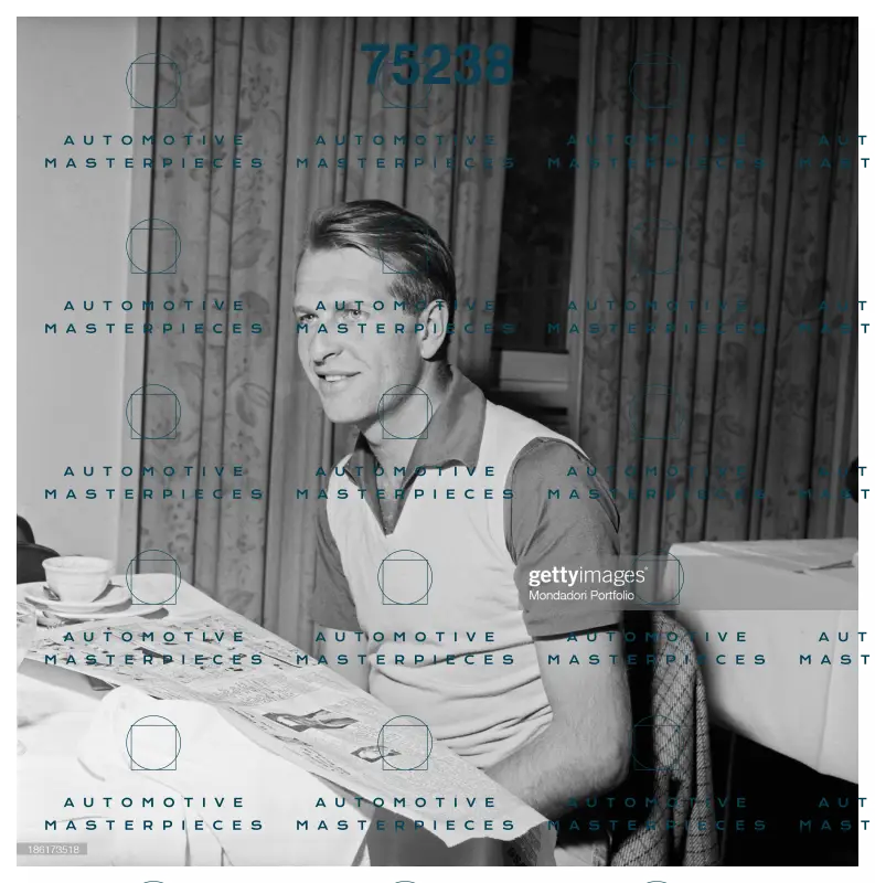 GETTY 186173518_british-racing-driver-peter-collins-smiling-seated-at-the-table-at-.jpg
