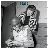 GETTY 186173515_louise-collins-looking-at-her-husband-and-british-racing-driver-pet.jpg